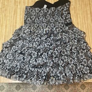 This dress is back with silver lace ruffles and plastic boning in the top